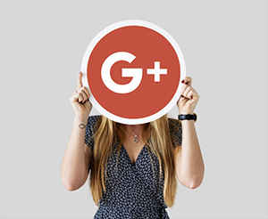woman holding google + logo
